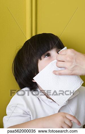 Little boy blowing nose with adult's help, cropped View Large Photo Image Stock Photography - Little boy blowing nose with adult's help, cropped. Fotosearch