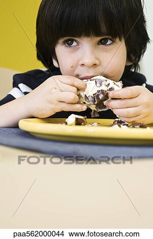 Little boy eating messy ice cream bar View Large Photo Image Picture - Little boy eating messy ice cream bar. Fotosearch