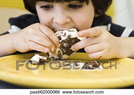 Little boy eating messy ice cream bar View Large Photo Image Stock Photograph - Little boy eating messy ice cream bar. Fotosearch