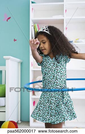 Little girl playing with plastic hoop View Large Photo Image Stock Photo - Little girl playing with plastic hoop. Fotosearch