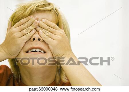 Boy covering eyes with hands View Large Photo Image Stock Photo - Boy covering eyes with hands. Fotosearch