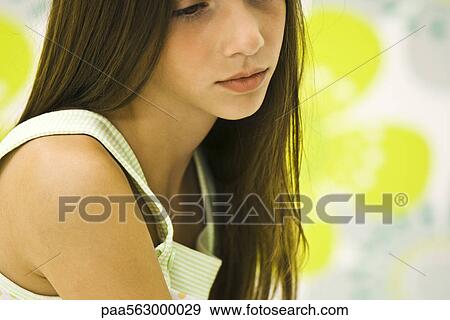 Girl contemplatively looking down View Large Photo Image Stock Photo - Girl contemplatively looking down. Fotosearch