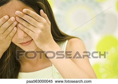 Girl covering eyes with hands View Large Photo Image Stock Photography - Girl covering eyes with hands. Fotosearch