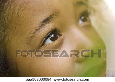 Little girl looking up, close-up View Large Photo Image Picture - Little girl looking up, close-up. Fotosearch