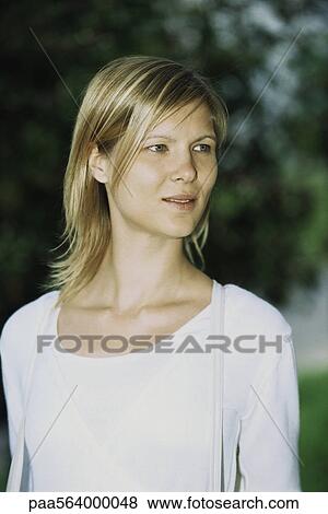 Blonde woman contemplatively looking away, portrait View Large Photo Image Stock Photo - Blonde woman contemplatively looking away, portrait. Fotosearch