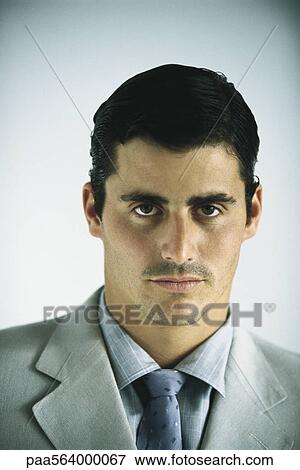 Businessman looking confidently at camera, portrait View Large Photo Image Stock Photo - Businessman looking confidently at camera, portrait. Fotosearch