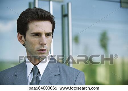 Businessman outside office building, portrait View Large Photo Image Stock Photography - Businessman outside office building, portrait. Fotosearch