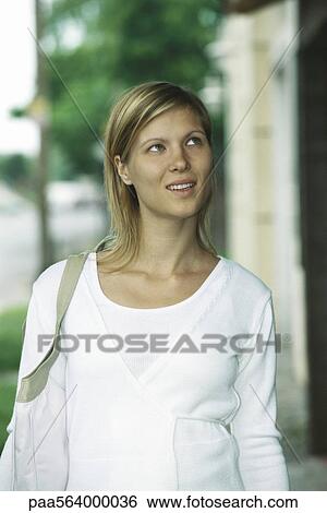 Stock Photograph - Woman looking up, portrait. Fotosearch