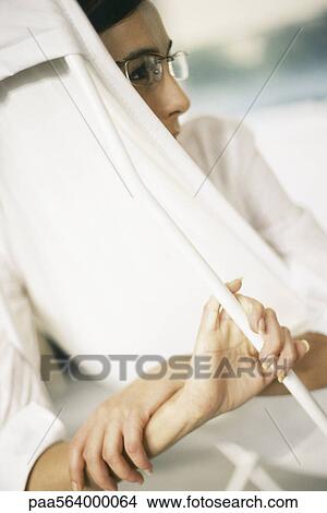 Woman reclining on lounge chair, looking away View Large Photo Image Picture - Woman reclining on lounge chair, looking away. Fotosearch