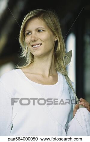Woman smiling, looking away, portrait View Large Photo Image Stock Image - Woman smiling, looking away, portrait. Fotosearch