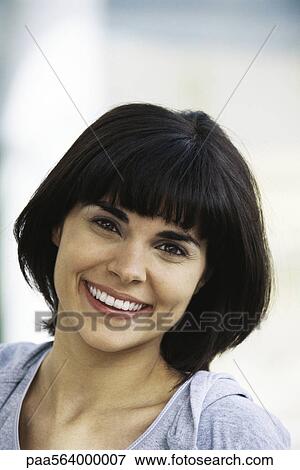 Stock Photo - Woman smiling, portrait. Fotosearch