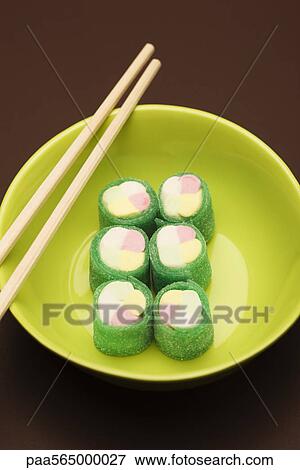 Stock Photo - Food concept, candy rolled to look like maki sushi rolls. Fotosearch