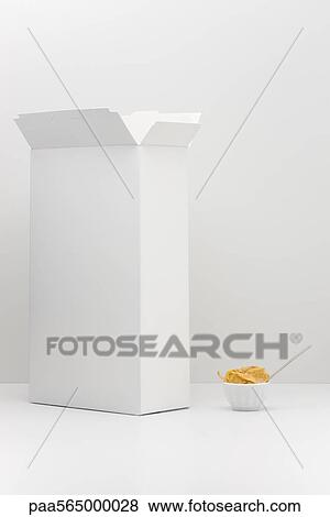 Food concept, cereal box with small bowl of cereal View Large Photo Image Stock Photo - Food concept, cereal box with small bowl of cereal. Fotosearch