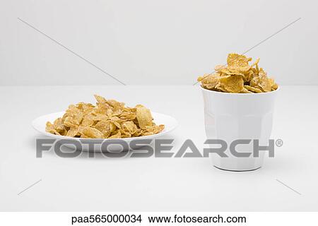 Food concept, cereal filling bowl and glass View Large Photo Image Picture - Food concept, cereal filling bowl and glass. Fotosearch