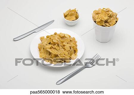 Stock Photo - Food concept, cereal filling plate, bowl and glass. Fotosearch