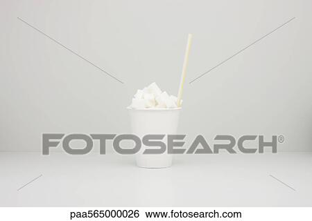 Food concept, disposable cup filled with sugar cubes View Large Photo Image Stock Photograph - Food concept, disposable cup filled with sugar cubes. Fotosearch