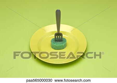 Food concept, fork with rolled up gummy candy strip on plate, resembling pasta View Large Photo Image Stock Image - Food concept, fork with rolled up gummy candy strip on plate, resembling pasta. Fotosearch