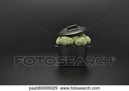 Food concept, fresh broccoli overflowing pot View Large Photo Image Stock Photo - Food concept, fresh broccoli overflowing pot. Fotosearch