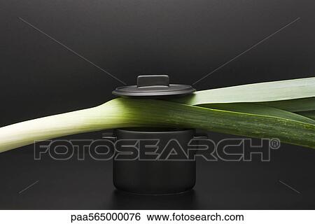 Food concept, leek and miniature pot View Large Photo Image Stock Photograph - Food concept, leek and miniature pot. Fotosearch