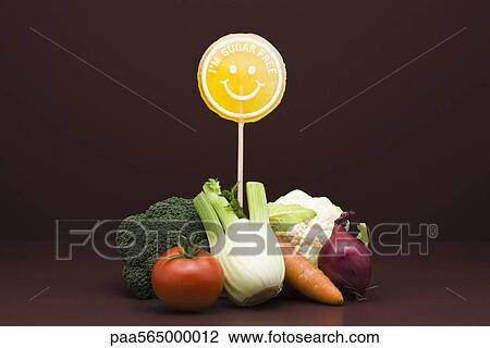 Food concept, pile of fresh vegetables with sugarfree lollipop View Large Photo Image Stock Image - Food concept, pile of fresh vegetables with sugarfree lollipop. Fotosearch