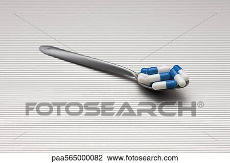 Food concept, pills on spoon View Large Photo Image Stock Image - Food concept, pills on spoon. Fotosearch