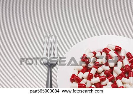 Food concept, plate full of pills View Large Photo Image Picture - Food concept, plate full of pills. Fotosearch