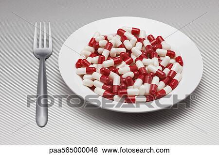 Food concept, plate full of pills View Large Photo Image Stock Photo - Food concept, plate full of pills. Fotosearch
