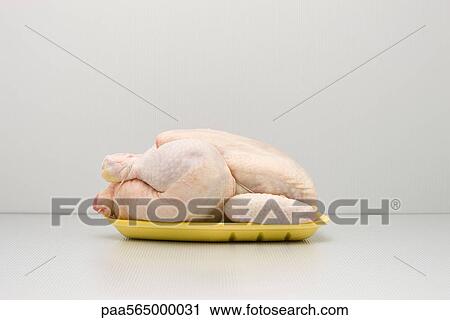 Food concept, raw whole chicken on polystyrene tray View Large Photo Image Stock Image - Food concept, raw whole chicken on polystyrene tray. Fotosearch