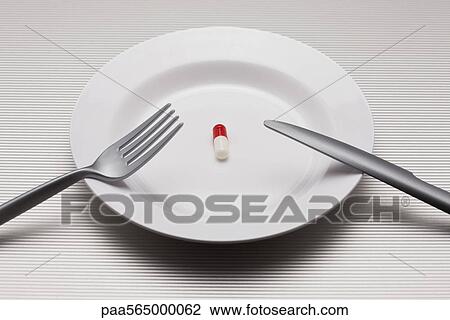 Food concept, single pill on plate View Large Photo Image Stock Image - Food concept, single pill on plate. Fotosearch