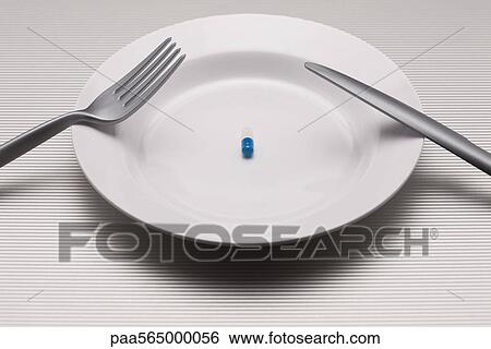 Food concept, single pill on plate View Large Photo Image Stock Photograph - Food concept, single pill on plate. Fotosearch