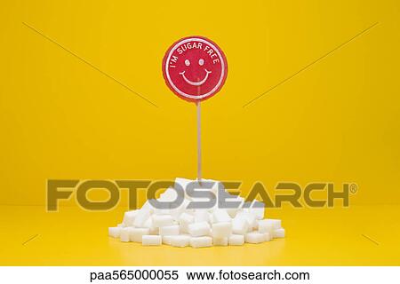 Food concept, sugar-free lollipop sticking out of pile of sugar cubes View Large Photo Image Stock Photography - Food concept, sugar-free lollipop sticking out of pile of sugar cubes. Fotosearch
