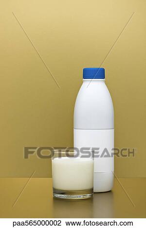Stock Image - Glass and bottle of milk. Fotosearch