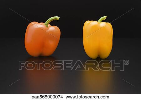 Orange and yellow bell peppers View Large Photo Image Picture - Orange and yellow bell peppers. Fotosearch