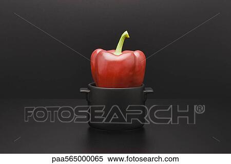 Stock Photography - Red bell pepper in miniature pot. Fotosearch