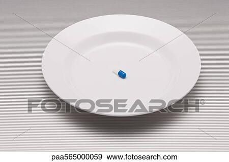 Single pill on plate View Large Photo Image Stock Photo - Single pill on plate. Fotosearch