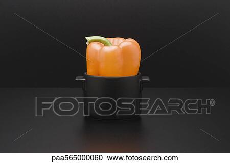 Yellow bell pepper in miniature pot View Large Photo Image Stock Image - Yellow bell pepper in miniature pot. Fotosearch