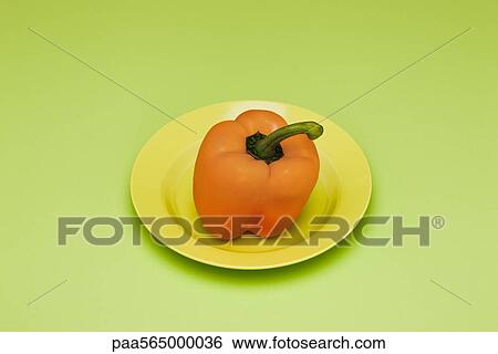 Yellow bell pepper on plate View Large Photo Image Stock Photograph - Yellow bell pepper on plate. Fotosearch