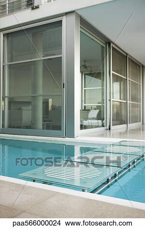 Footbridge leading across pool at resort View Large Photo Image Picture - Footbridge leading across pool at resort. Fotosearch