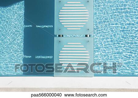Stepping stones crossing swimming pool, overhead view View Large Photo Image Stock Image - Stepping stones crossing swimming pool, overhead view. Fotosearch