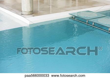 Stepping stones spanning deep end of swimming pool View Large Photo Image Stock Image - Stepping stones spanning deep end of swimming pool. Fotosearch