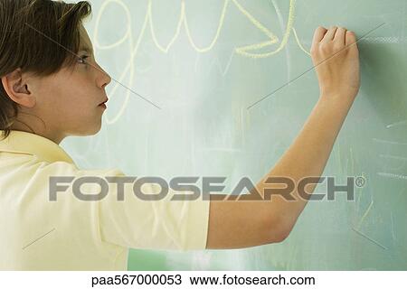 Boy writing in cursive on blackboard View Large Photo Image Stock Image - Boy writing in cursive on blackboard. Fotosearch