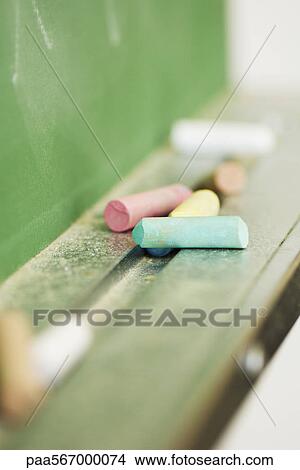 Chalk resting on blackboard, close-up View Large Photo Image Picture - Chalk resting on blackboard, close-up. Fotosearch