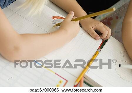 Child scribbling on graph paper, cropped View Large Photo Image Stock Photograph - Child scribbling on graph paper, cropped. Fotosearch