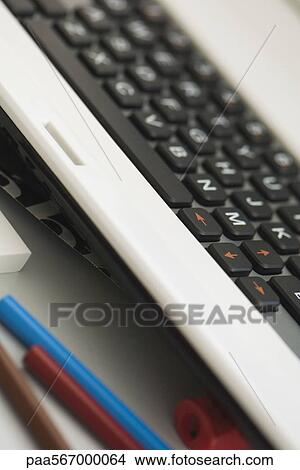 Computer keyboard and colored pencils, close-up View Large Photo Image Picture - Computer keyboard and colored pencils, close-up. Fotosearch