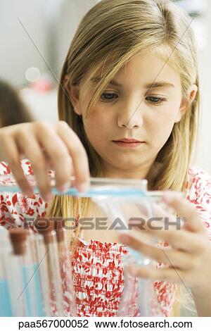 Elementary student conducting science experiment View Large Photo Image Stock Image - Elementary student conducting science experiment. Fotosearch