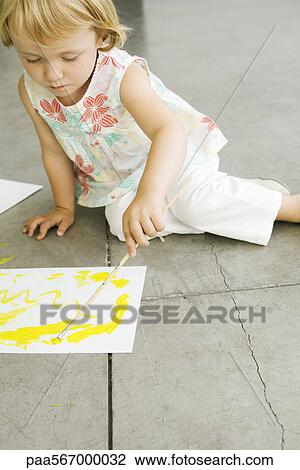 Little girl painting on paper View Large Photo Image Stock Image - Little girl painting on paper. Fotosearch