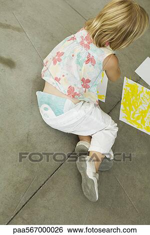 Preschool girl sitting on ground painting, high angle view View Large Photo Image Stock Photograph - Preschool girl sitting on ground painting, high angle view. Fotosearch