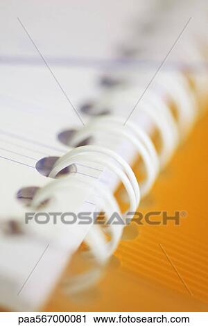 Stock Image - Spiral notebook, extreme close-up. Fotosearch