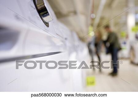 Control knob on appliance, shoppers in background View Large Photo Image Stock Image - Control knob on appliance, shoppers in background. Fotosearch