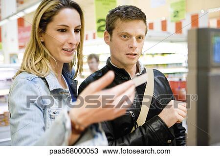 Couple shopping together View Large Photo Image Stock Image - Couple shopping together. Fotosearch